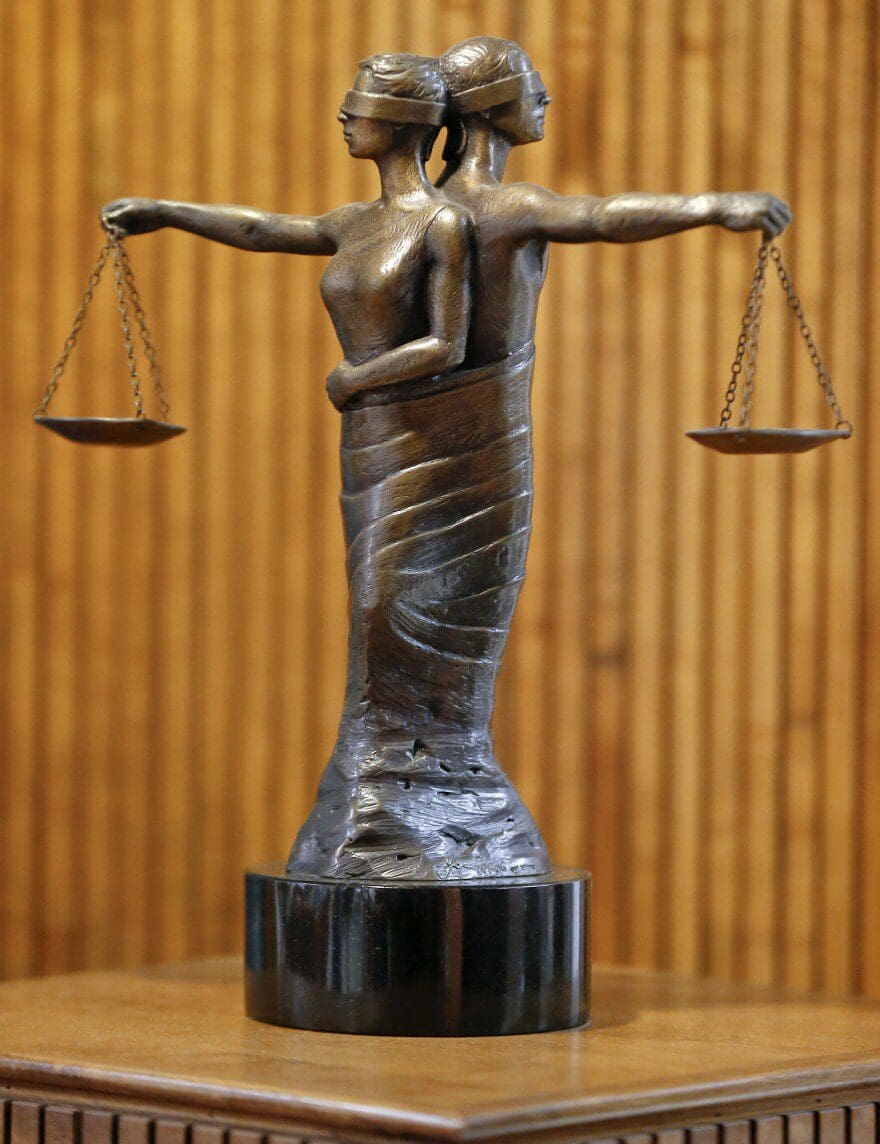 A photo of the scales of justice in a court room. 