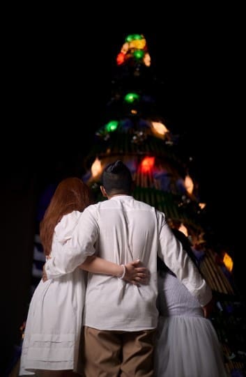 Family in front of the Christmas tree
